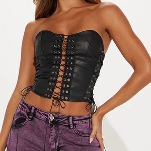 Fashion Nova. Black leather corset and lavender dark wash denim jeans.